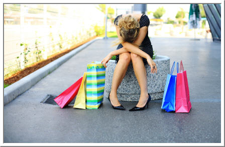 10 great reasons to hire a stylist, woman hates shopping, defeated shopping experience, woman with shopping bags, colorful shopping bags, upset woman, mad about shopping